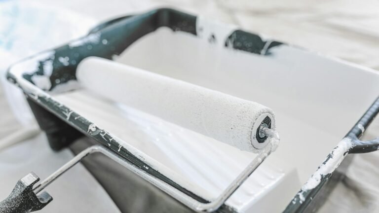Paint roller with fresh paint for an affordable home makeover