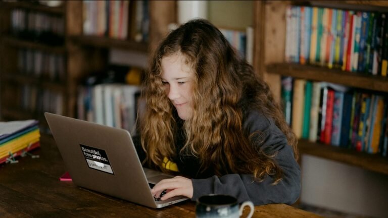 Student learning online with a laptop at home