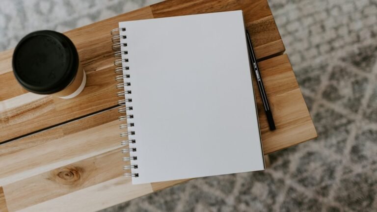 Blank notebook and pen for writing a small business plan