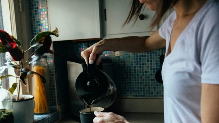 Pouring a cup of coffee as part of a calm morning routine